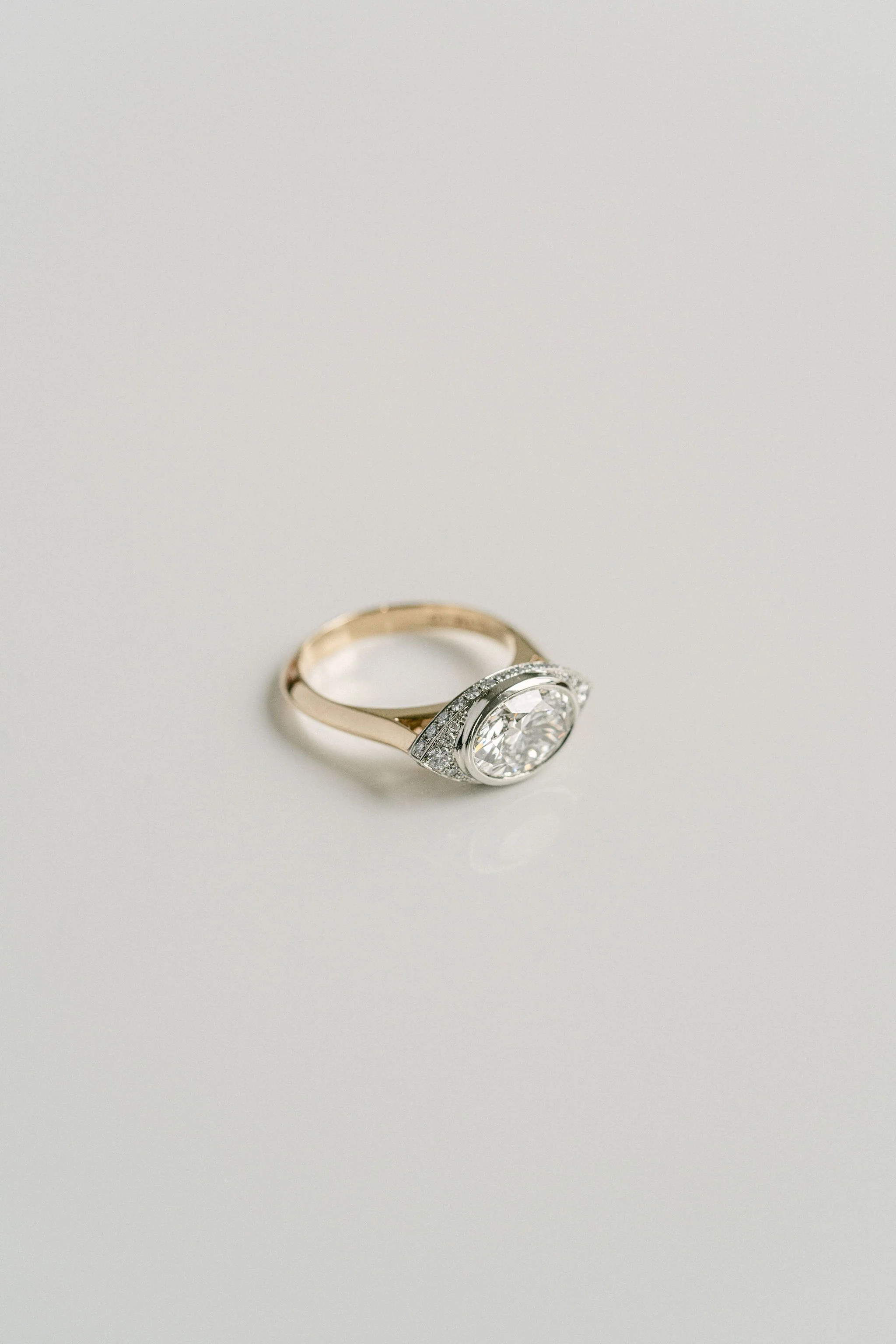 Oval Diamond Two Tone Ring With Diamond Eye Halo - Image 6